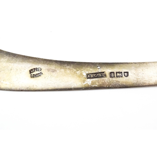 303 - A silver model of a boomerang, hallmarked London 1911, maker Asprey & Co. Ltd. Approx. 7