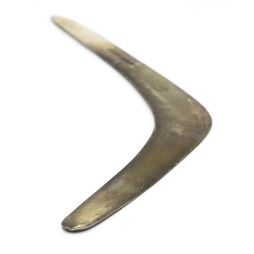 303 - A silver model of a boomerang, hallmarked London 1911, maker Asprey & Co. Ltd. Approx. 7