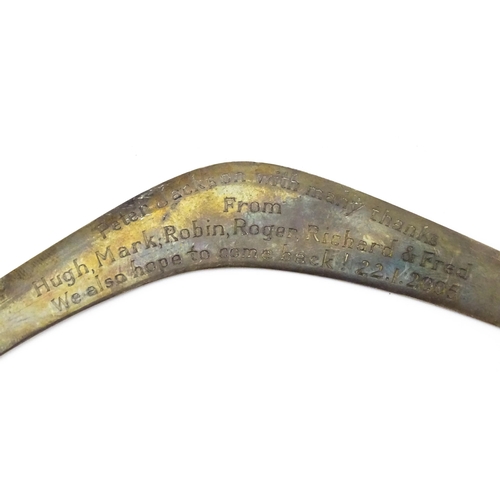 303 - A silver model of a boomerang, hallmarked London 1911, maker Asprey & Co. Ltd. Approx. 7