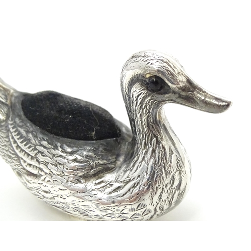 305 - A silver pin cushion formed as a duck. Approx. 2