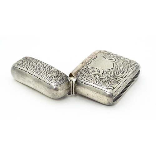 309 - A silver vesta case with engraved decoration hallmarked Birmingham 1903, maker William Henry Sparrow... 