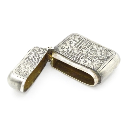 309 - A silver vesta case with engraved decoration hallmarked Birmingham 1903, maker William Henry Sparrow... 