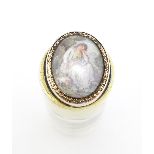 311 - A Victorian glass scent bottle with silver gilt top surmounted by a hand painted cabochon depicting ... 