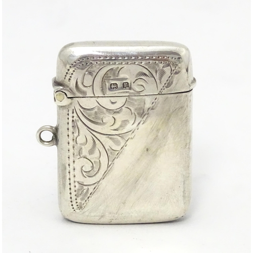 323 - A silver vesta case with engraved decoration hallmarked Birmingham 1916, maker Jones & Crompton. App... 