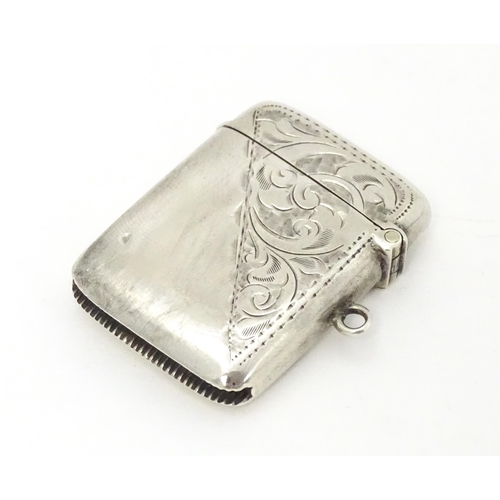 323 - A silver vesta case with engraved decoration hallmarked Birmingham 1916, maker Jones & Crompton. App... 