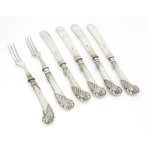 324 - Four butter / tea knives with silver pistol grip handles. Together with two forks. Hallmarked Sheffi... 