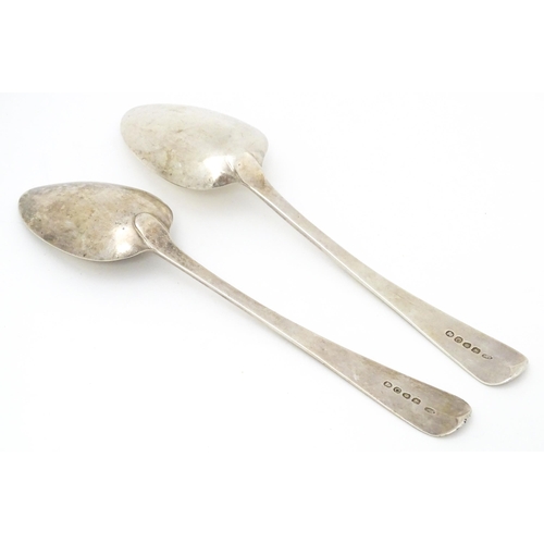 327 - A pair of Geo III silver table spoons hallmarked London 1818, maker TW. Approx. 8 3/4