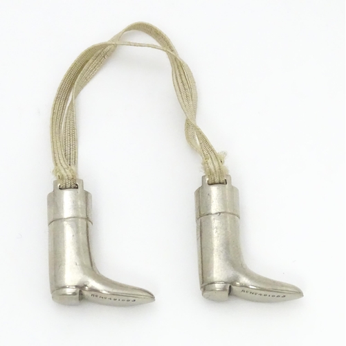 333 - An unusual pair of early 20thC novelty silver plate knitting needle guards formed as riding boots. M... 