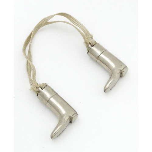 333 - An unusual pair of early 20thC novelty silver plate knitting needle guards formed as riding boots. M... 