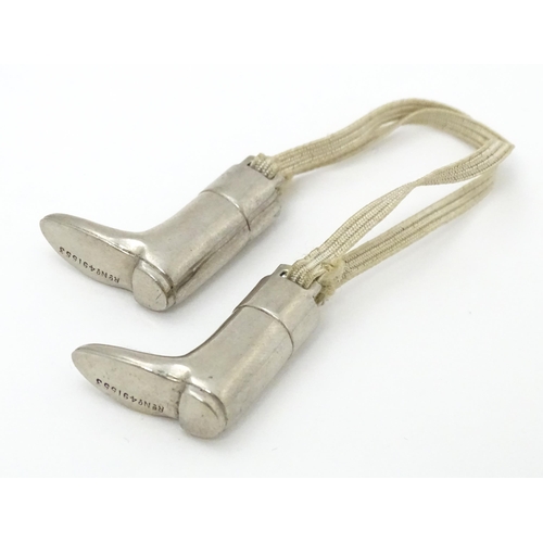 333 - An unusual pair of early 20thC novelty silver plate knitting needle guards formed as riding boots. M... 