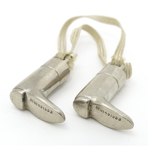 333 - An unusual pair of early 20thC novelty silver plate knitting needle guards formed as riding boots. M... 