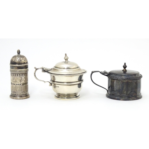 335 - A silver mustard pot hallmarked Birmingham 1926, maker Mappin & Webb Ltd. Together with another hall... 