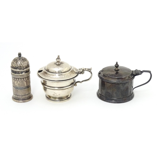 335 - A silver mustard pot hallmarked Birmingham 1926, maker Mappin & Webb Ltd. Together with another hall... 