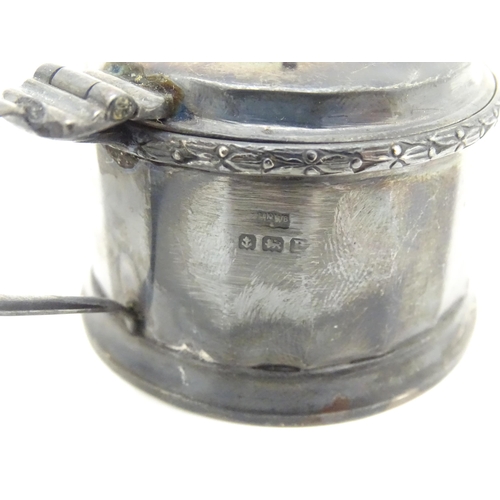 335 - A silver mustard pot hallmarked Birmingham 1926, maker Mappin & Webb Ltd. Together with another hall... 