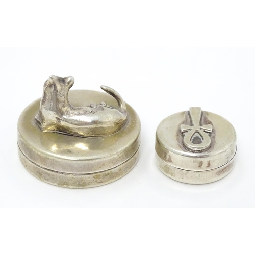 337 - Two Continental silver pill boxes, one surmounted by a model of a cat, bearing silver marks for Iraq... 