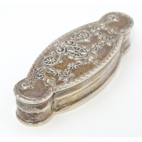 338 - A silver pill box of shaped form. Approx. 2 1/4