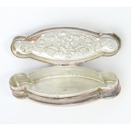 338 - A silver pill box of shaped form. Approx. 2 1/4