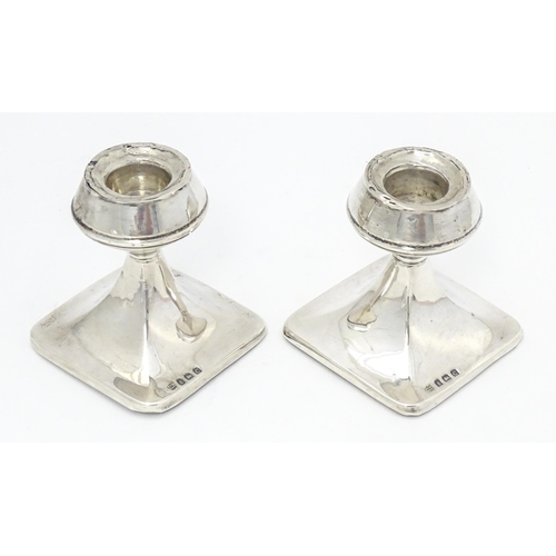 343 - A pair of silver short candlesticks hallmarked Birmingham 1927, William J. Myatt & Co. Approx. 2 3/4... 