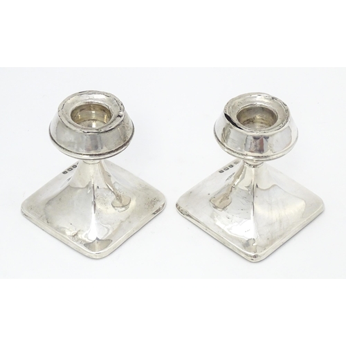 343 - A pair of silver short candlesticks hallmarked Birmingham 1927, William J. Myatt & Co. Approx. 2 3/4... 