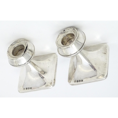 343 - A pair of silver short candlesticks hallmarked Birmingham 1927, William J. Myatt & Co. Approx. 2 3/4... 