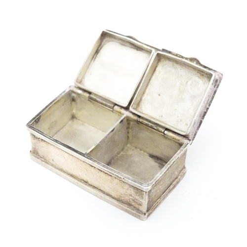 346 - A silver two sectional pill box with engraved acanthus scroll decoration, bearing import marks. Lond... 