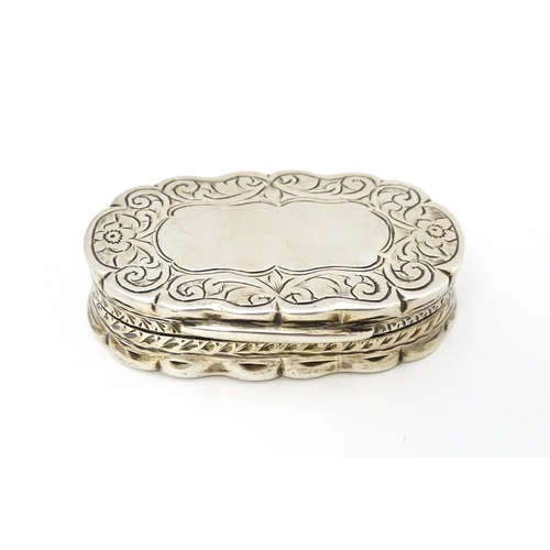 353 - A silver pill box with engraved decoration hallmarked Birmingham 1920, maker George Randle. Approx. ... 