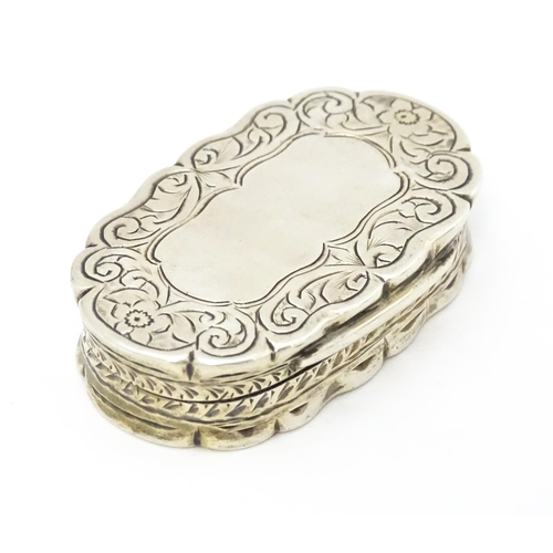 353 - A silver pill box with engraved decoration hallmarked Birmingham 1920, maker George Randle. Approx. ... 