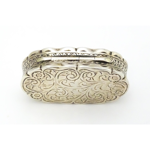 353 - A silver pill box with engraved decoration hallmarked Birmingham 1920, maker George Randle. Approx. ... 