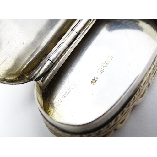 353 - A silver pill box with engraved decoration hallmarked Birmingham 1920, maker George Randle. Approx. ... 