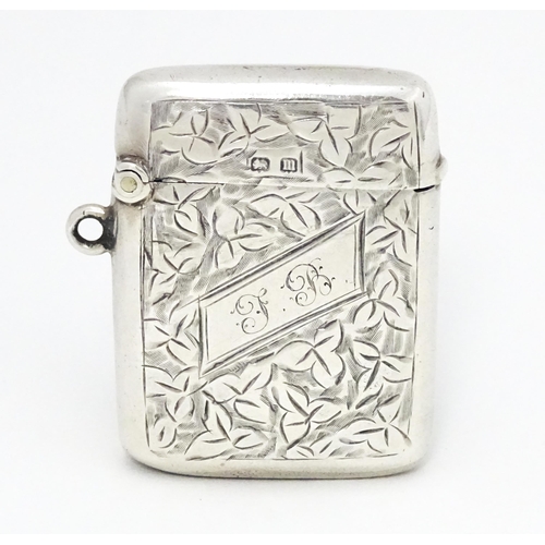 355 - A silver vesta case with engraved foliate decoration hallmarked Birmingham 1911, maker Smith & Bartl... 