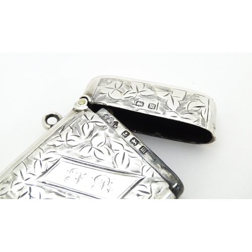 355 - A silver vesta case with engraved foliate decoration hallmarked Birmingham 1911, maker Smith & Bartl... 