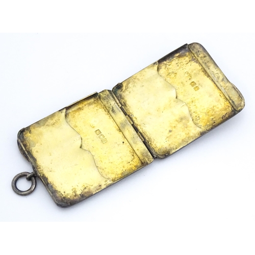 362 - A silver shooting butt marker case of slim form, opening to reveal a gilded interior with two five s... 