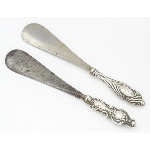 371 - Two silver handled shoe horns, one hallmarked Birmingham 1899 the other Chester 1920.   The longest ... 