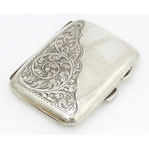 375 - A silver cigarette case with engraved acanthus scroll detail and gilded interior.  hallmarked Birmin... 