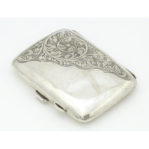 375 - A silver cigarette case with engraved acanthus scroll detail and gilded interior.  hallmarked Birmin... 