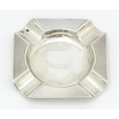 376 - A silver ash tray with engine turned decoration hallmarked Birmingham 1960, maker Adie Brothers. App... 