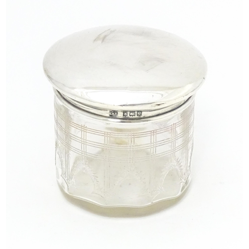 377 - A glass toilet jar with silver lid hallmarked Birmingham 1920 maker Deakin & Francis Approx. 2 1/2