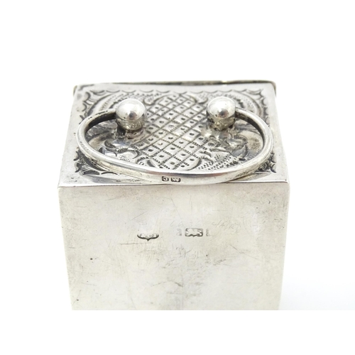 386 - A small silver clock case with embossed decoration hallmarked Birmingham 1902. Approx. 2 3/4