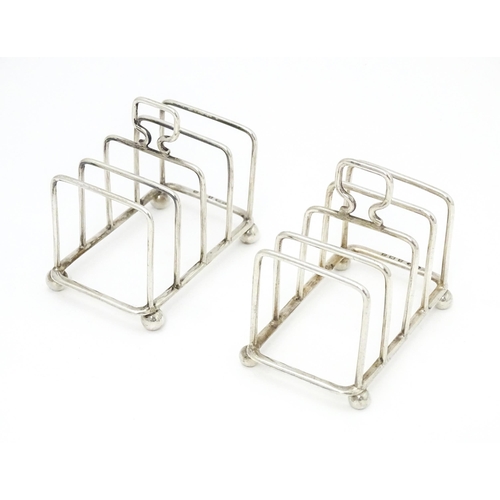 392 - Two silver 5-bar toast racks, hallmarked Birmingham 1931 / 1933 maker J E Bushell Approx. 3 1/4