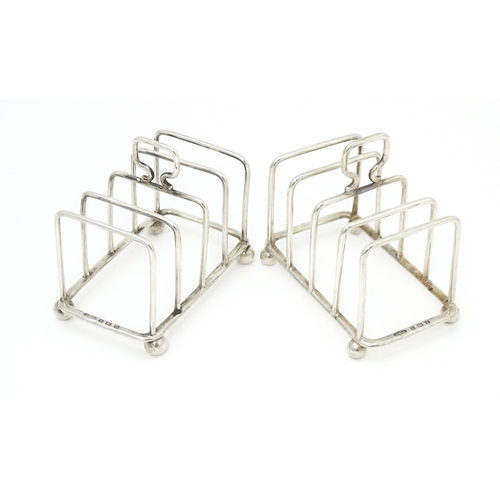 392 - Two silver 5-bar toast racks, hallmarked Birmingham 1931 / 1933 maker J E Bushell Approx. 3 1/4