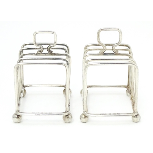 392 - Two silver 5-bar toast racks, hallmarked Birmingham 1931 / 1933 maker J E Bushell Approx. 3 1/4