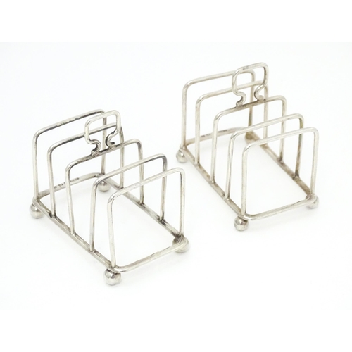 392 - Two silver 5-bar toast racks, hallmarked Birmingham 1931 / 1933 maker J E Bushell Approx. 3 1/4