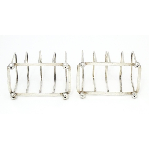 392 - Two silver 5-bar toast racks, hallmarked Birmingham 1931 / 1933 maker J E Bushell Approx. 3 1/4