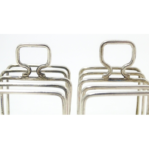 392 - Two silver 5-bar toast racks, hallmarked Birmingham 1931 / 1933 maker J E Bushell Approx. 3 1/4