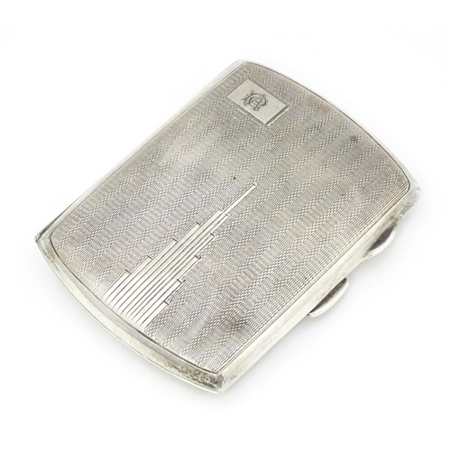 393 - A silver cigarette case with engine turned decoration hallmarked Birmingham 1934 with Jubilee mark. ... 