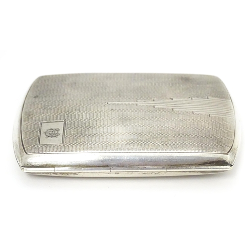 393 - A silver cigarette case with engine turned decoration hallmarked Birmingham 1934 with Jubilee mark. ... 