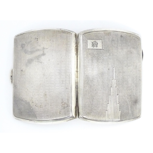 393 - A silver cigarette case with engine turned decoration hallmarked Birmingham 1934 with Jubilee mark. ... 