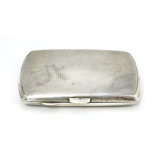 393 - A silver cigarette case with engine turned decoration hallmarked Birmingham 1934 with Jubilee mark. ... 