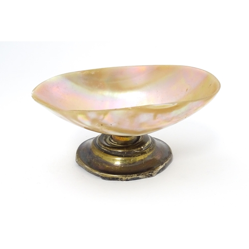 394 - A silver pedestal table salt with mother of pearl shell formed bowl Hallmarked Birmingham 1907 maker... 