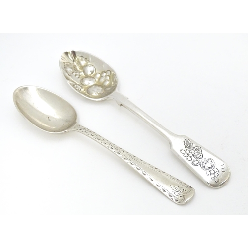 405 - Two silver teaspoons, one Victorian example with bright cut decoration hallmarked London 1877, maker... 